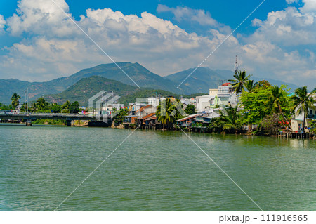 Houses on the river bank. 111916565