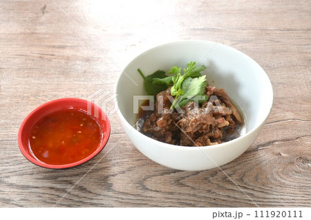 braised beef meat stew topping slice celery on bowl dipping chili sauce  111920111