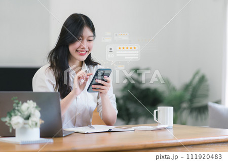 Asian female customer providing five satisfaction ratings. Customer review satisfaction feedback survey concept. 111920483