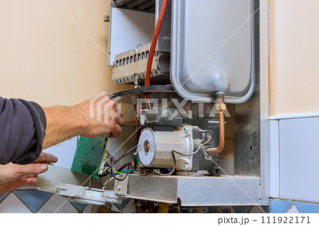 Providing gas water heater boiler repair services at home is responsibility of qualified engineer Providing gas water heater boiler repair services at home is responsibility of qualified engineer 111922171