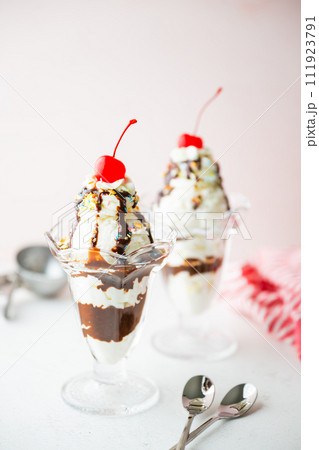 ice cream sundae with cherries and nuts ice cream sundae with cherries and nuts 111923791