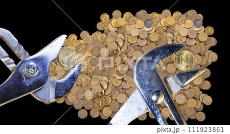 Allegory of the global financial crisis - Iron 10 rubles coin (written ten rubles, Bank of Russia in the Russian) in the grip of economic crisis, on a black background. Finance and business concept 111923861