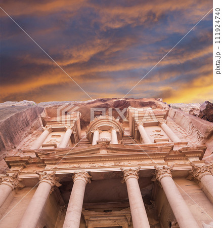Al Khazneh or The Treasury (against the background of a beautiful sky with clouds). Petra, Jordan-- it is a symbol of Jordan, as well as Jordan's most-visited tourist attraction 111924740