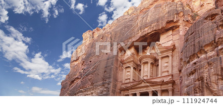 Al Khazneh or The Treasury (against the background of a beautiful sky with clouds). Petra, Jordan-- it is a symbol of Jordan, as well as Jordan's most-visited tourist attraction 111924744