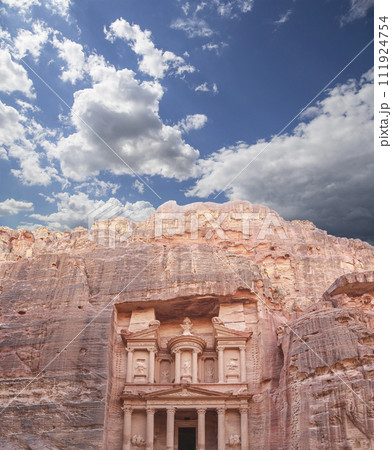 Al Khazneh or The Treasury (against the background of a beautiful sky with clouds). Petra, Jordan-- it is a symbol of Jordan, as well as Jordan's most-visited tourist attraction 111924754