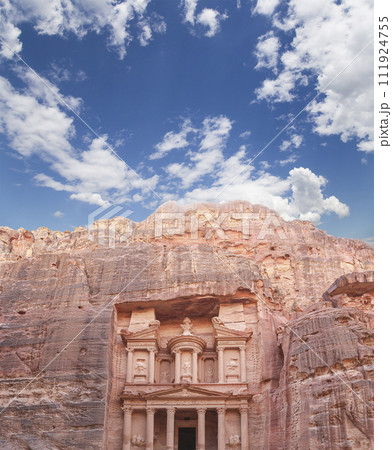 Al Khazneh or The Treasury (against the background of a beautiful sky with clouds). Petra, Jordan-- it is a symbol of Jordan, as well as Jordan's most-visited tourist attraction 111924755