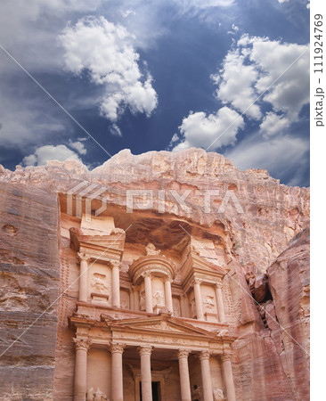 Al Khazneh or The Treasury (against the background of a beautiful sky with clouds). Petra, Jordan-- it is a symbol of Jordan, as well as Jordan's most-visited tourist attraction 111924769