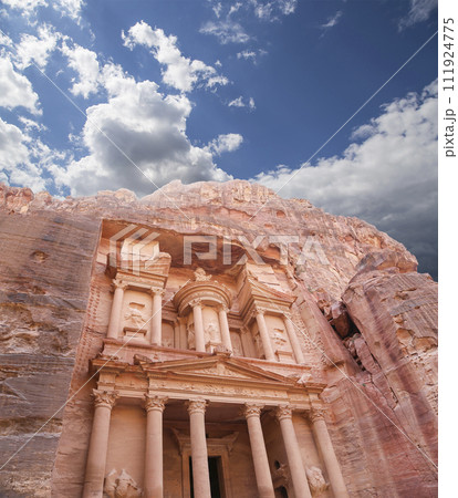 Al Khazneh or The Treasury (against the background of a beautiful sky with clouds). Petra, Jordan-- it is a symbol of Jordan, as well as Jordan's most-visited tourist attraction 111924775