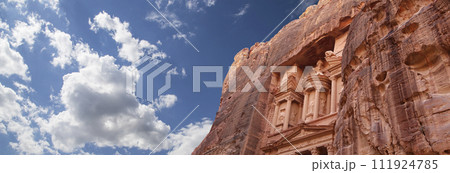 Al Khazneh or The Treasury (against the background of a beautiful sky with clouds). Petra, Jordan-- it is a symbol of Jordan, as well as Jordan's most-visited tourist attraction 111924785
