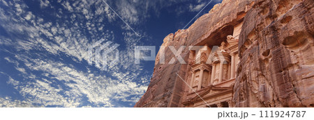 Al Khazneh or The Treasury (against the background of a beautiful sky with clouds). Petra, Jordan-- it is a symbol of Jordan, as well as Jordan's most-visited tourist attraction 111924787