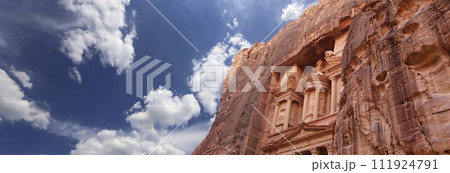 Al Khazneh or The Treasury (against the background of a beautiful sky with clouds). Petra, Jordan-- it is a symbol of Jordan, as well as Jordan's most-visited tourist attraction 111924791
