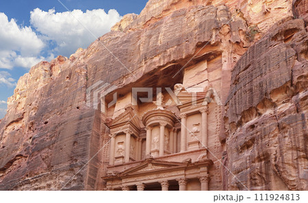 Al Khazneh or The Treasury (against the background of a beautiful sky with clouds). Petra, Jordan-- it is a symbol of Jordan, as well as Jordan's most-visited tourist attraction 111924813