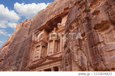 Al Khazneh or The Treasury (against the background of a beautiful sky with clouds). Petra, Jordan-- it is a symbol of Jordan, as well as Jordan's most-visited tourist attraction 111924821