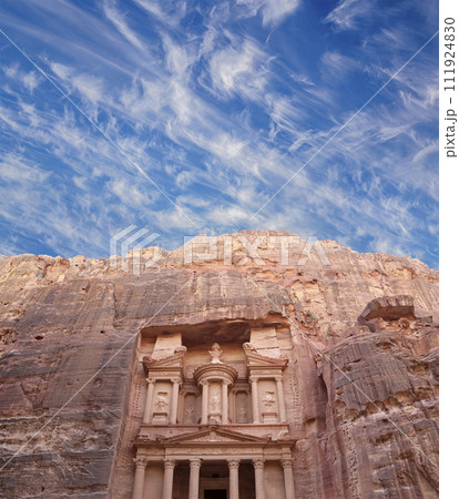 Al Khazneh or The Treasury (against the background of a beautiful sky with clouds). Petra, Jordan-- it is a symbol of Jordan, as well as Jordan's most-visited tourist attraction Al Khazneh or The Treasury (against the background of a beautiful sky with clouds). Petra, Jordan-- it is a symbol of Jordan, as well as Jordan's most-visited tourist attraction 111924830