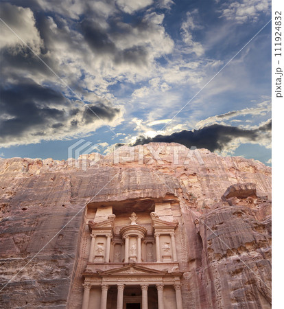 Al Khazneh or The Treasury (against the background of a beautiful sky with clouds). Petra, Jordan-- it is a symbol of Jordan, as well as Jordan's most-visited tourist attraction 111924832