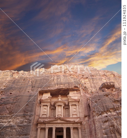 Al Khazneh or The Treasury (against the background of a beautiful sky with clouds). Petra, Jordan-- it is a symbol of Jordan, as well as Jordan's most-visited tourist attraction 111924835
