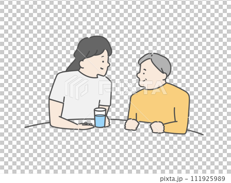 A female caregiver assisting an elderly man with taking medication. A female caregiver assisting an elderly man with taking medication. 111925989
