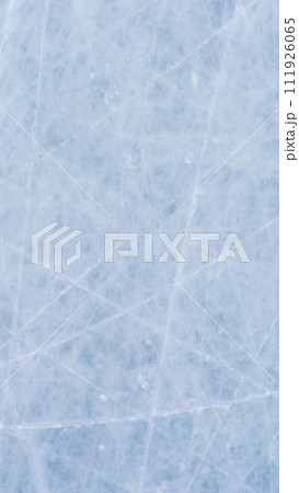 Ice background with marks from skating and hockey, blue texture of rink surface with scratches 111926065