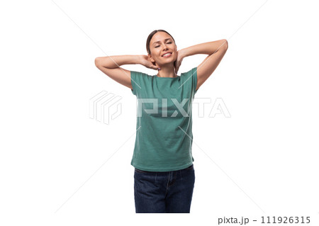 30 year old positive brunette woman with collected hair is dressed in a green basic t-shirt on an 30 year old positive brunette woman with collected hair is dressed in a green basic t-shirt on an 111926315