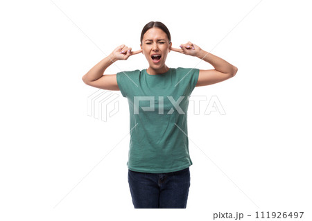 young brunette woman feels angry and closes her ears 111926497
