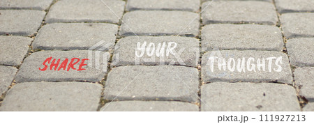 Share your thoughts symbol. Concept words Share your thoughts on beautiful grey paving slabs. Beautiful grey paving slabs background. Business share your thoughts concept. Copy space. 111927213