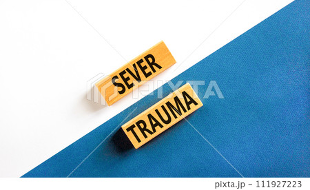 Sever trauma symbol. Concept words Sever trauma on wooden blocks. Beautiful white and blue background. Psychological and sever trauma concept. Copy space. Sever trauma symbol. Concept words Sever trauma on wooden blocks. Beautiful white and blue background. Psychological and sever trauma concept. Copy space. 111927223