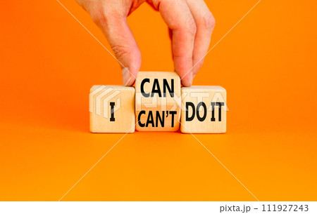 I can do it symbol. Concept word I can or can not do it on beautiful wooden cubes. Beautiful orange table orange background. Businessman hand. Business and i can or not do it concept. Copy space. 111927243