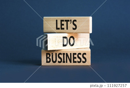 let is do business symbol. Concept words let is do business on beautiful wooden blocks. Beautiful grey table grey background. let is do business concept. Copy space. 111927257