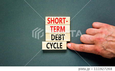 Short-term debt cycle symbol. Concept words Short-term debt cycle on beautiful wooden block. Beautiful grey table grey background. Businessman hand. Business Short-term debt cycle concept. Copy space. Short-term debt cycle symbol. Concept words Short-term debt cycle on beautiful wooden block. Beautiful grey table grey background. Businessman hand. Business Short-term debt cycle concept. Copy space. 111927268