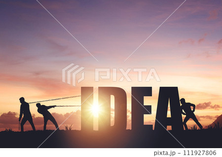 Silhouettes of people drawing the word IDEA on a sunset background, business concept 111927806