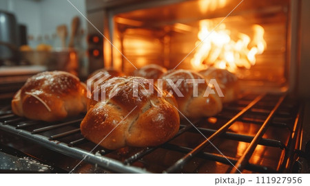 Baking Treats. Kitchen filled with aroma of freshly baked hot cross buns Baking Treats. Kitchen filled with aroma of freshly baked hot cross buns 111927956