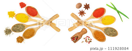 mix of spices in wooden spoon isolated on a white background. Top view. Flat lay. Set or collection 111928084