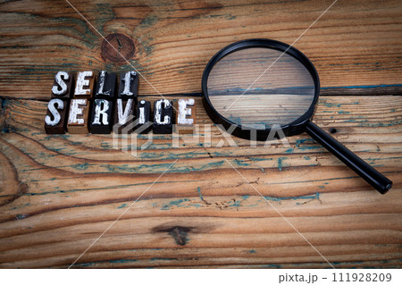 SELF SERVICE. Alphabet letters on wood texture background SELF SERVICE. Alphabet letters on wood texture background 111928209