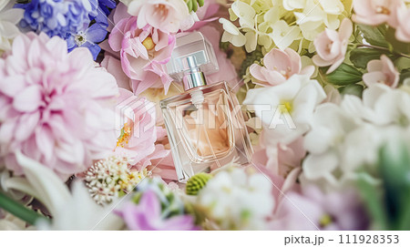 Perfume bottle in flowers, fragrance on blooming background, floral scent and cosmetic product 111928353
