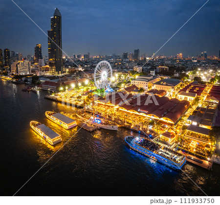 Aerial view of Asiatique The Riverfront open night market at the Chao Phraya river in Bangkok 111933750
