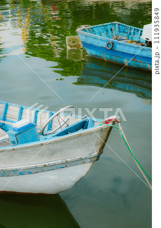 fishing boats moored at the lake 111935849