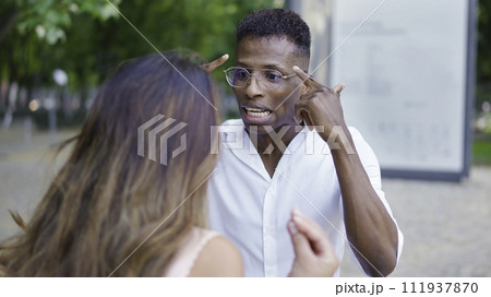 Couple arguing and yelling in the street Couple arguing and yelling in the street 111937870