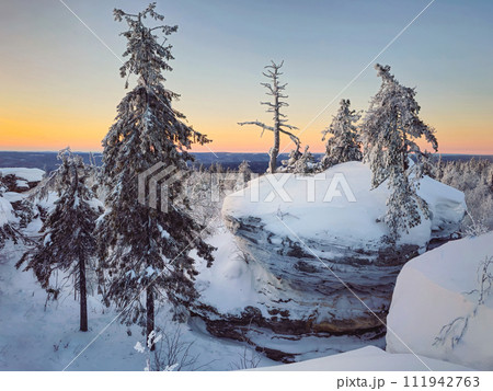 Mystical dawn in the snow-covered mountains. Mystical dawn in the snow-covered mountains. 111942763