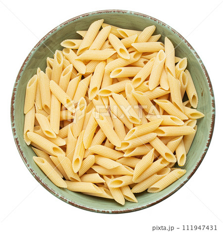 Pennette rigate. Raw pasta in a plate isolated on white background. Top view. 111947431
