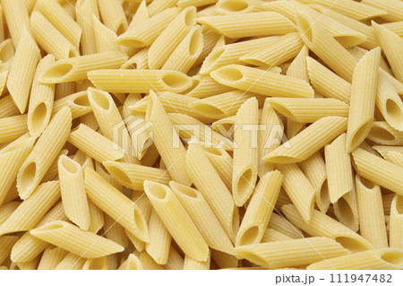 Pennette rigate. Background of raw pasta. 111947482