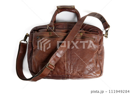 Brown briefcase bag with shoulder strap made of rough buffalo leather isolated on white background 111949284