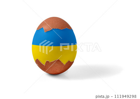 Half shelled Easter chicken egg painted blue and yellow and isolated on a white background Half shelled Easter chicken egg painted blue and yellow and isolated on a white background 111949298