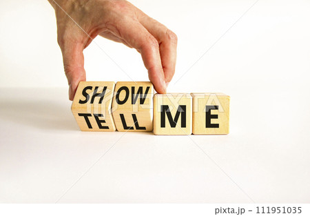 Tell or show me symbol. Businessman turns beautiful wooden cubes and changes words Tell me to Show me. Beautiful white table white background. Business tell or show me concept. Copy space. Tell or show me symbol. Businessman turns beautiful wooden cubes and changes words Tell me to Show me. Beautiful white table white background. Business tell or show me concept. Copy space. 111951035