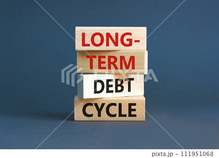 Long-term debt cycle symbol. Concept words Long-term debt cycle on beautiful wooden block. Beautiful grey table grey background. Business Long-term debt cycle concept. Copy space. 111951068