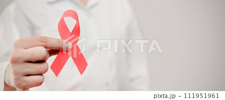 Man holding cancer awareness ribbon 111951961