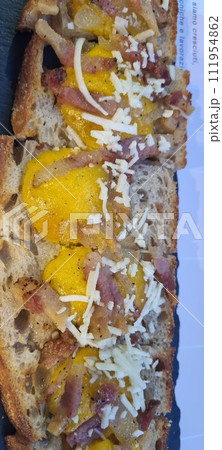 Tasty bacon and egg breakfast sandwich on artisan bread Tasty bacon and egg breakfast sandwich on artisan bread 111954862