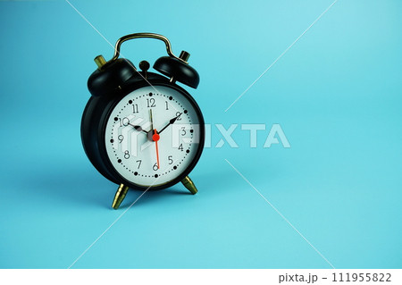 Alarm clock with space copy on blue background 111955822
