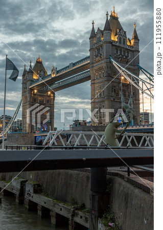 View of famous Tower bridge and skyline with reflections in the river thames just after sunset. View of famous Tower bridge and skyline with reflections in the river thames just after sunset. 111955880