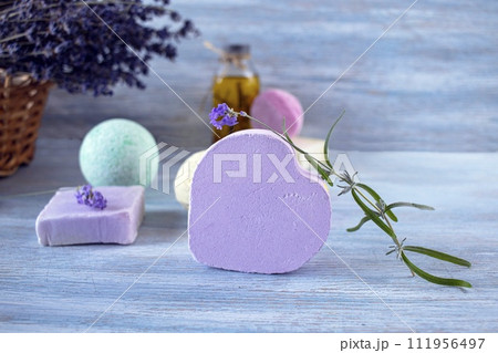 Lavender soap, fragrance oil, foam bombs and fresh lavender flowers on a wooden background, bath products Lavender soap, fragrance oil, foam bombs and fresh lavender flowers on a wooden background, bath products 111956497