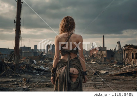 Rear view of women dressed in rags in a post-apocalyptic futuristic environment 111958489